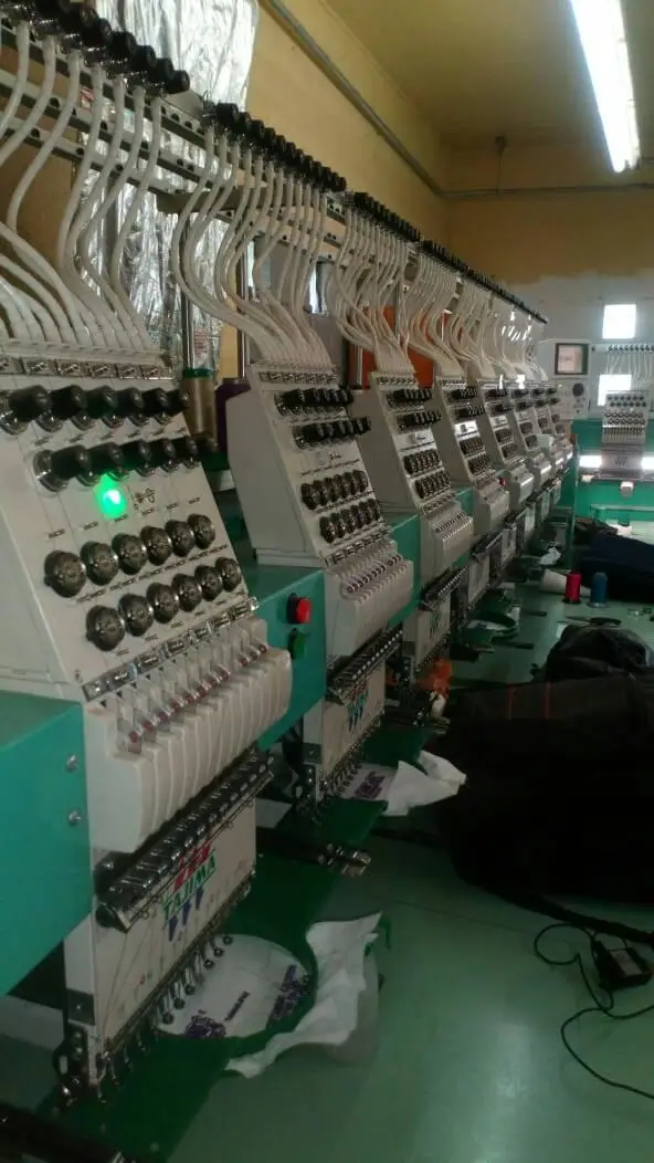 Tajima Embroidery Machines with a Backdrop of Isacord Thread