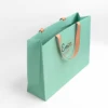 Paper bag with sticking handle
