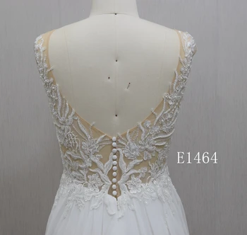 Sleeveless lace wedding dress with dreamy bateau