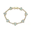 Bracciale con diamanti blu mare dorato