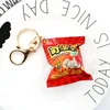Pendentif breloque fruit de cola-fermoir mousqueton