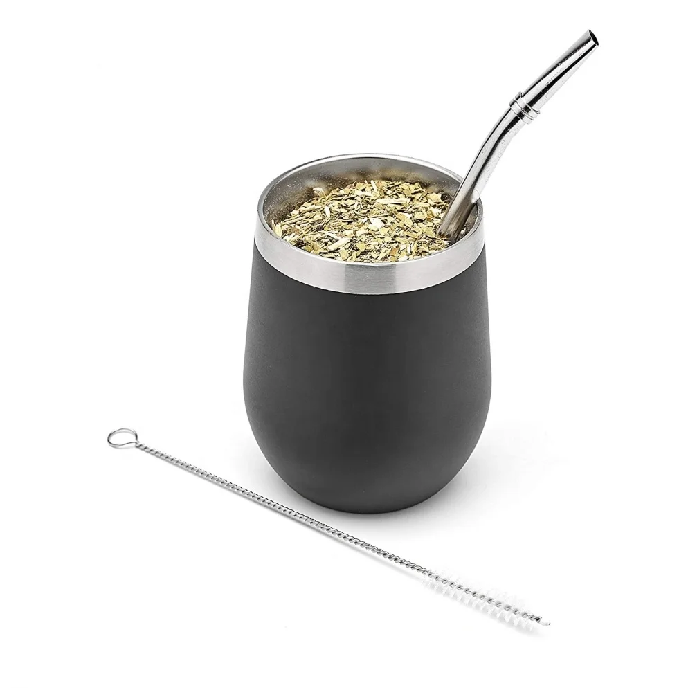 Premium Photo  Sharing yerba mate tea in wooden mate cup with bombilla  metal straw serving as a tea