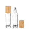 clear bottle + steel rollers + bamboo lid