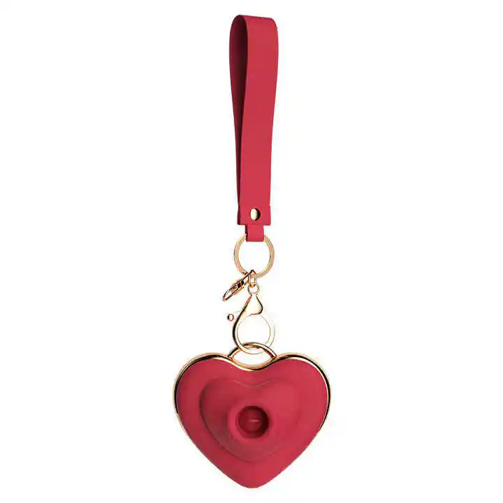 Compact heart-shaped egg vibrator size comparison and lanyard detail