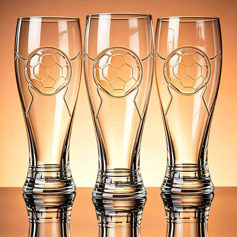 Tall beer glasses with a football motif on the bowl