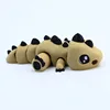 Estegosaurio pequeño de 10 cm, color hueso.