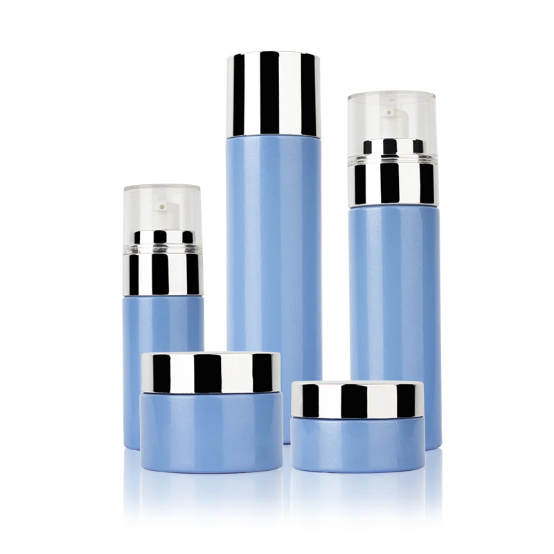 Cosmetic packaging 15ml 30ml 50ml round twist up airless pump bottle cosmetic skin oil glass bottle blue spray bottle