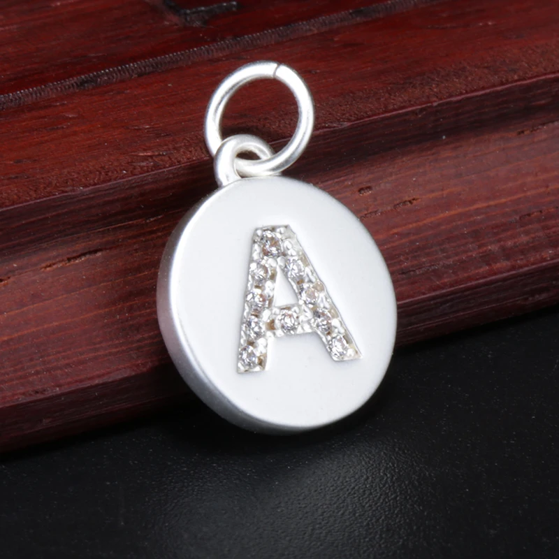 Charm with letter N, silver and stones
