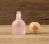 Tapa de madera rosa de 10 ml con logo del Árbol de la Vida