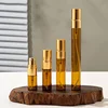 Botellas de ámbar con pulverizador dorado