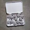 Caja de almacenamiento gris, paquete de 12, con clavos de tela y alfileres de acero.