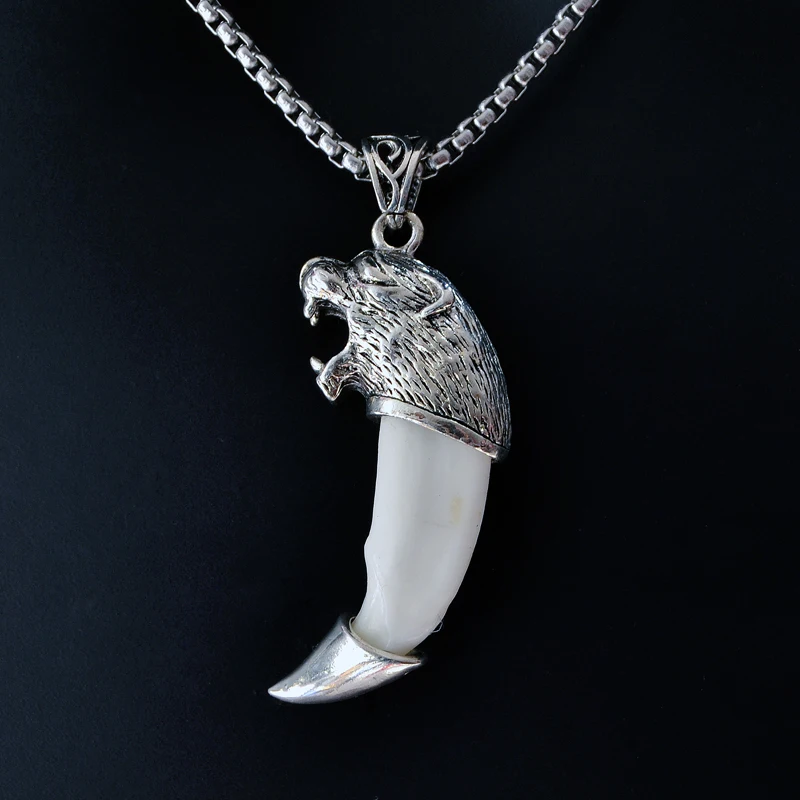 Silver necklace with tibetan charm