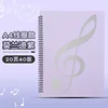 สมุดโน้ตสีม่วงแบบ 2 หน้า พร้อมสันเกลียว รองรับแผ่นโน้ตเพลงได้ 40 แผ่น