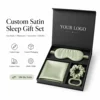 Antifaz verde para dormir, funda de almohada y coleteros con caja.