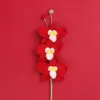 Tre rami di orchidea rossa con farfalle
