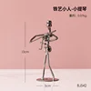 Figura artistica in ferro a forma di violino