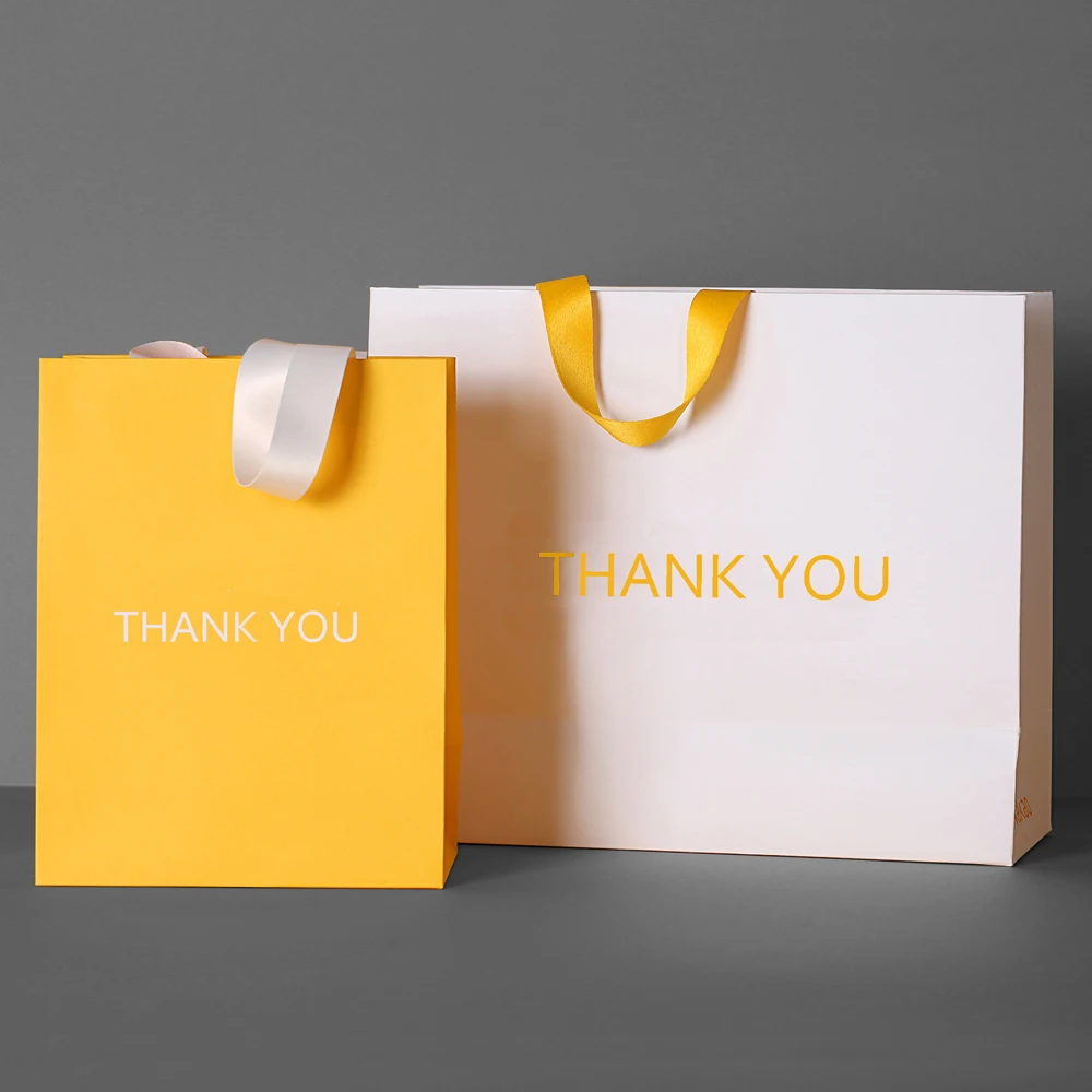 Luxury Custom Brand Name Logo Gold Foil Stamping Gift Packaging Black Craft  Carry Paper Shopping Bag with Ribbon Handle Guangzhou Yison Printing Co.,Ltd