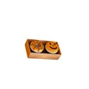 Cabeza de calabaza con donut de telaraña marrón