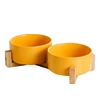 Orange double bowl with wooden frame