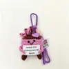 Colgante extintor morado
