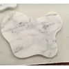 Marbre blanc papillon