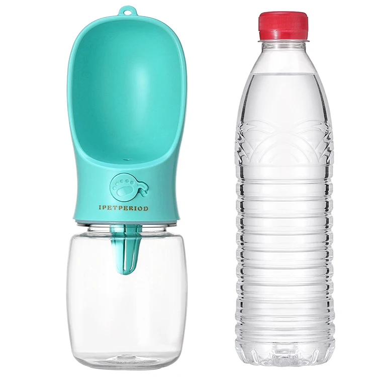 Dog drinking water bottle