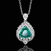 Emerald pendant with cross chain
