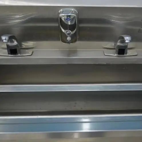 Heavy-duty commercial hand-washing and sanitizing stations for sanitary areas of meat processing plants