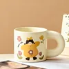 Yellow-clad girl, chubby cup