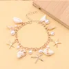 Pulsera de estrella de mar y caracola