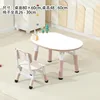 Tableau blanc, table et chaise rose bégonia