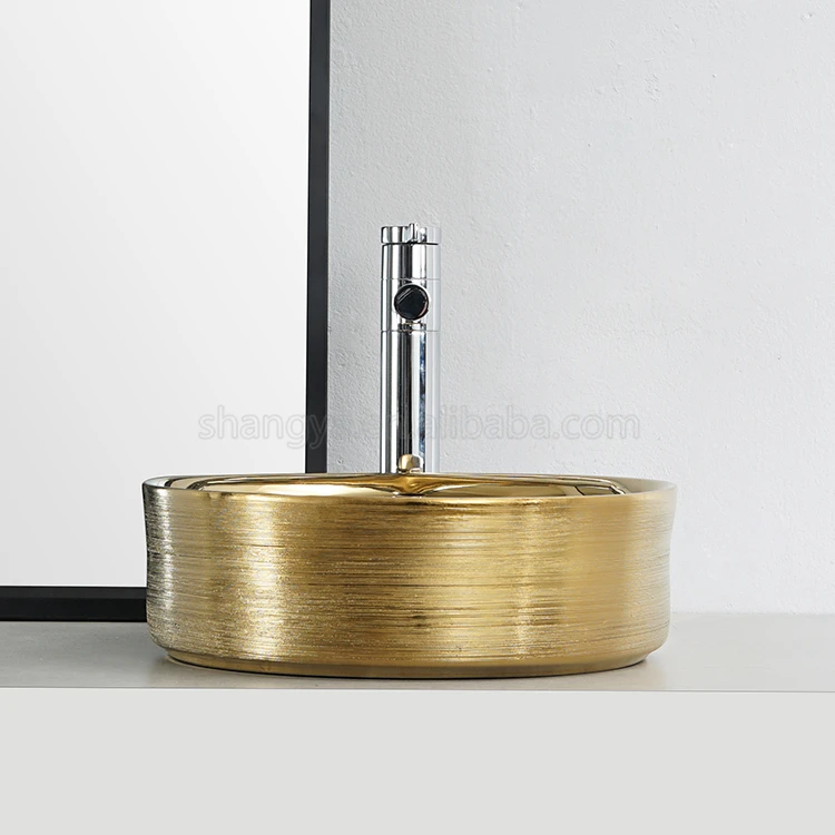 Round golden plated luxury ceramic sanitary wares table counter top washbasin bathroom sink art basin gold face hand wash basin factory