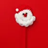 Rama de flores con cabeza de Papá Noel rojo - (Varilla roja)