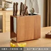 Soporte para cuchillos y palillos de madera de ébano.