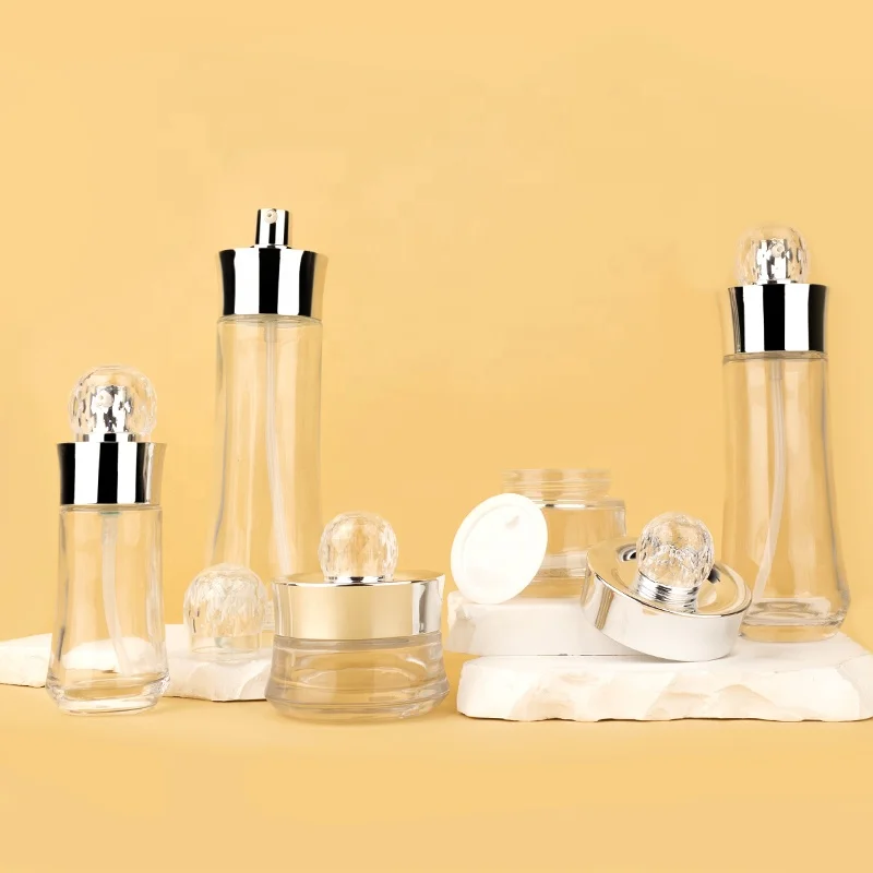 glass bottle jar skin care packaging gold ball shape unique lotion pump cream jar glass bottle set