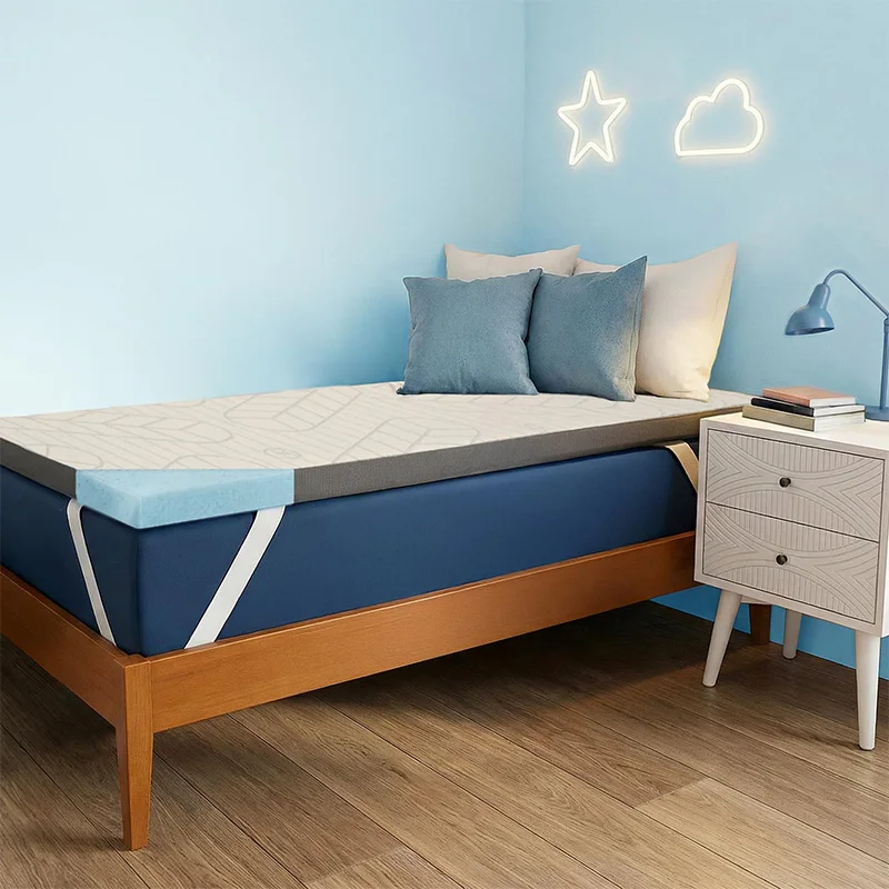 Queen size gel-infused memory foam mattress topper on modern bedroom bed