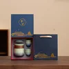 Confezione regalo sfumata da una pentola e quattro tazze-blu