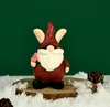 Dy2229a christmas elf takes flowers