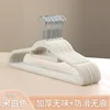 Off-white adult flocked clothes hanger