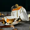 B-2 tasses, 2 plats, 2 cuillères + porte-tasses