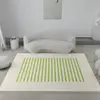 Fond blanc avec de longues rayures vertes