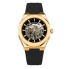 Reloj automático dorado con correa de caucho.