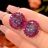 Black gold dried rose ear studs