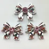 10#: fiocco grande con diamante rosa