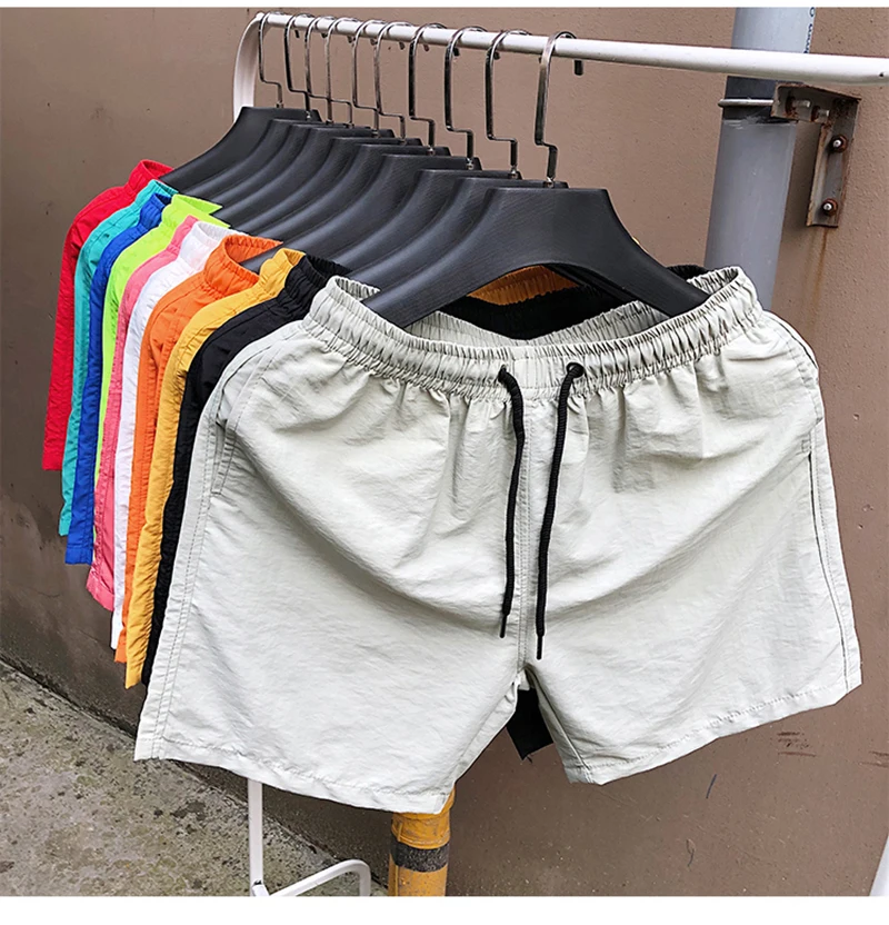 Pantaloncini da surf all'ingrosso Pantaloncini casual da spiaggia da uomo personalizzati Capispalla di moda Costume da surf allentato impermeabile484_voghion.com