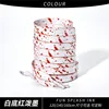 หมึกสีแดงสาดบนพื้นหลังสีขาว