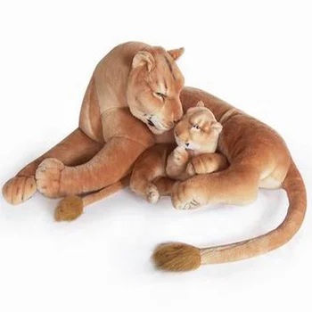 Female lion deals stuffed animal