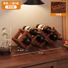 Two-tiered folding wine rack in brown (holds 5 bottles)