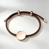 Cordoncino marrone + ciondolo in oro rosa