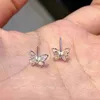 Piccoli orecchini a farfalla con zirconi colorati